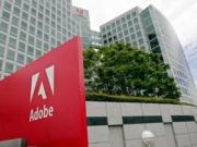 Прибыль  компании Adobe уменьшится в 2013 году
